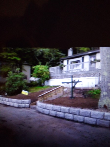 Completed seawall with graded and stabilized shoreline